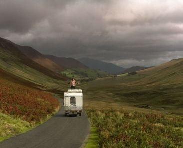 man-standing-van-against-sky