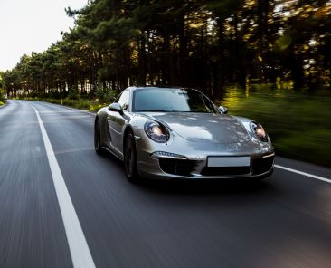mini-coupe-high-speed-drive-road-with-front-lights