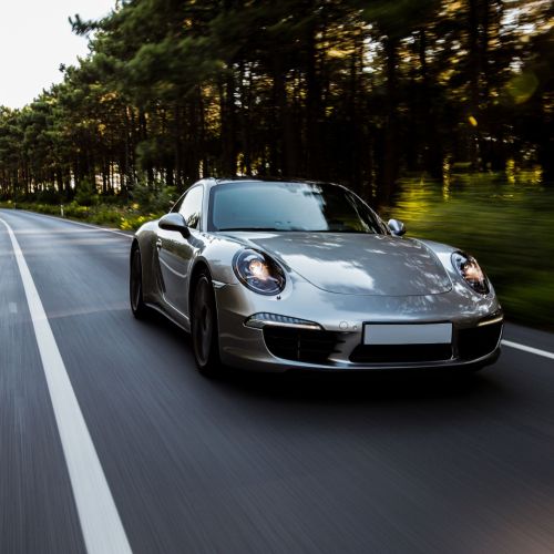 mini-coupe-high-speed-drive-road-with-front-lights